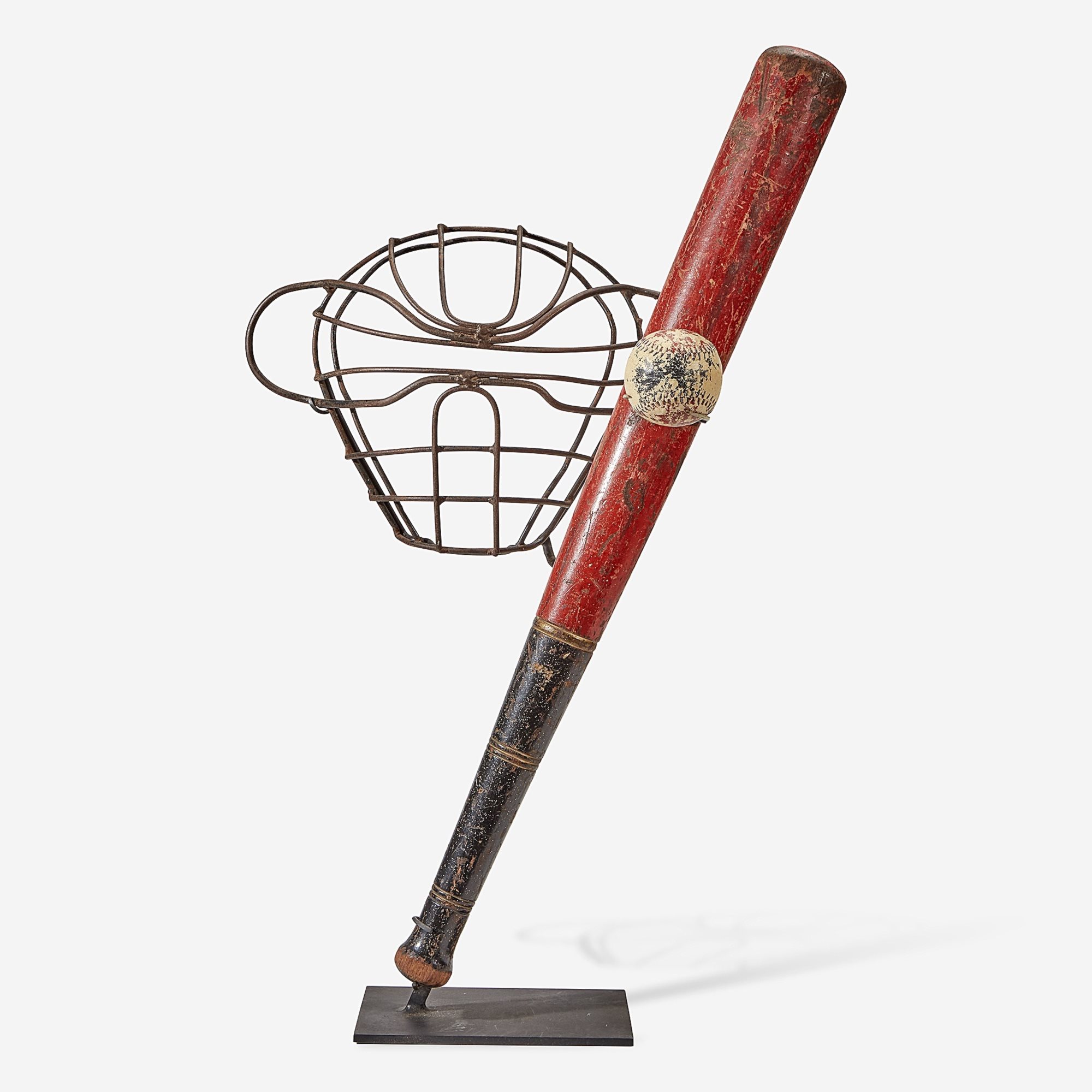 a mounted display of a twentieth century baseball bat, catcher’s mask and ball.