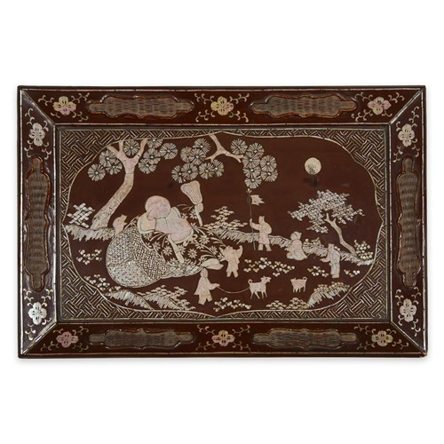 Lot 89 - A Chinese mother of pearl-inlaid reddish-brown lacquer tray