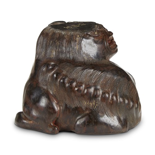 Lot 180 - A Chinese carved hardwood lion-form cup