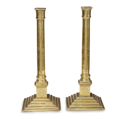 Lot 12 - Pair of floral-etched brass candlesticks