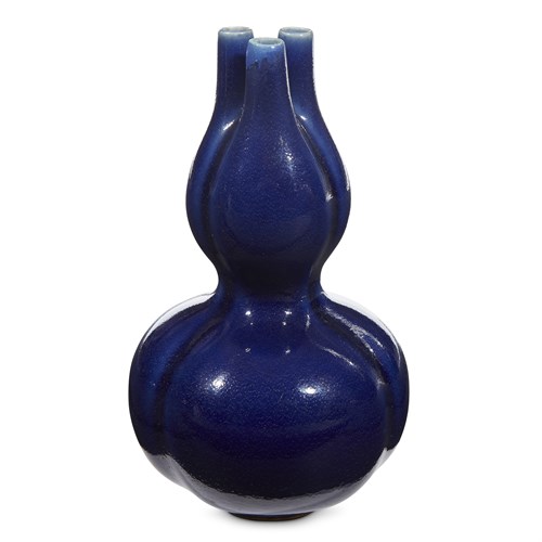 Lot 143 - A Chinese cobalt blue-glazed tri-lobed double-gourd vase