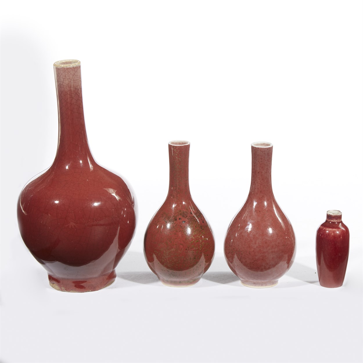 Lot 147 - Three Chinese copper red-glazed vases and a snuff bottle