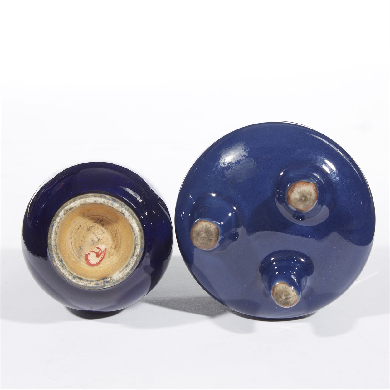 Lot 151 - A small Chinese cobalt blue-glazed tripod censer and a small bottle vase