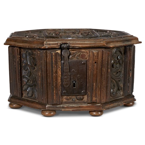 Lot 73 - A FRENCH OR FLEMISH LATE GOTHIC CARVED WALNUT OCTAGONAL CASKET