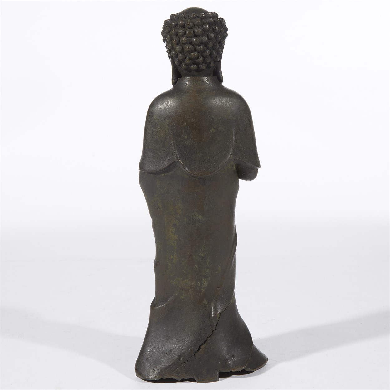Lot 86 - A Chinese patinated bronze figure of standing Buddha