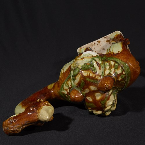 Lot 23 - A Chinese sancai-glazed pottery model of a camel