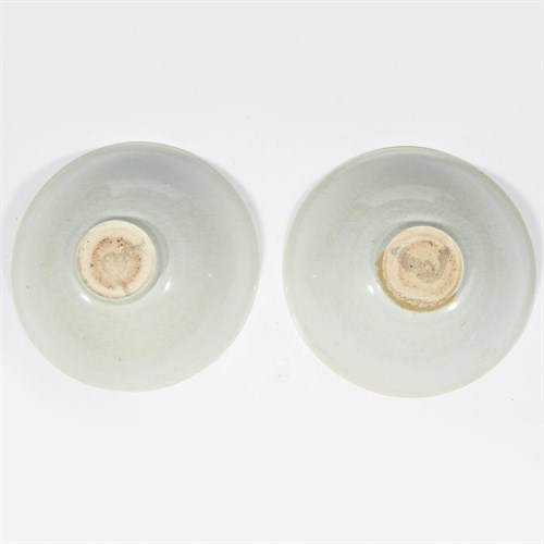 Lot 19 - A pair of Chinese peony-incised qingbai bowls