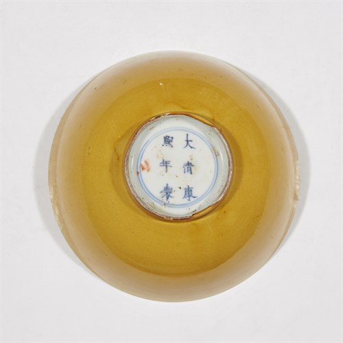 Lot 135 - A Chinese yellow-glazed porcelain bowl
