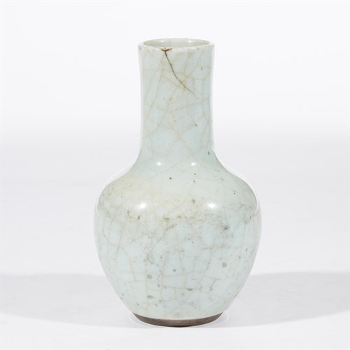 Lot 137 - A Chinese pale celadon-glazed bottle vase
