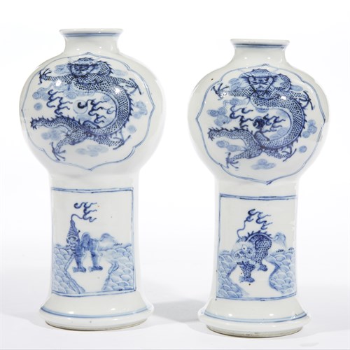 Lot 219 - A pair of blue and white porcelain "Dragon and Qilin" vases