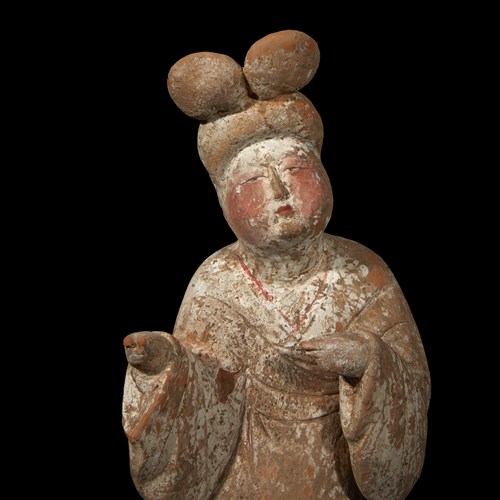 Lot 21 - A Chinese painted pottery figure of a court lady