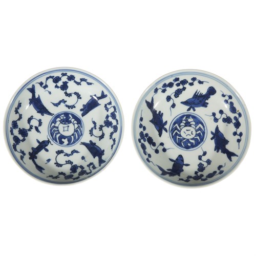 Lot 67 - A pair of Chinese small blue and white porcelain "Crab and Fish" dishes