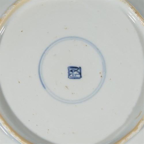 Lot 99 - A matched pair of Chinese blue and white "Dragon and Fish" dishes