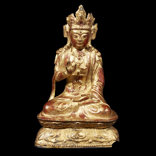 Lot 88 - A Chinese lacquered bronze figure of seated Guanyin