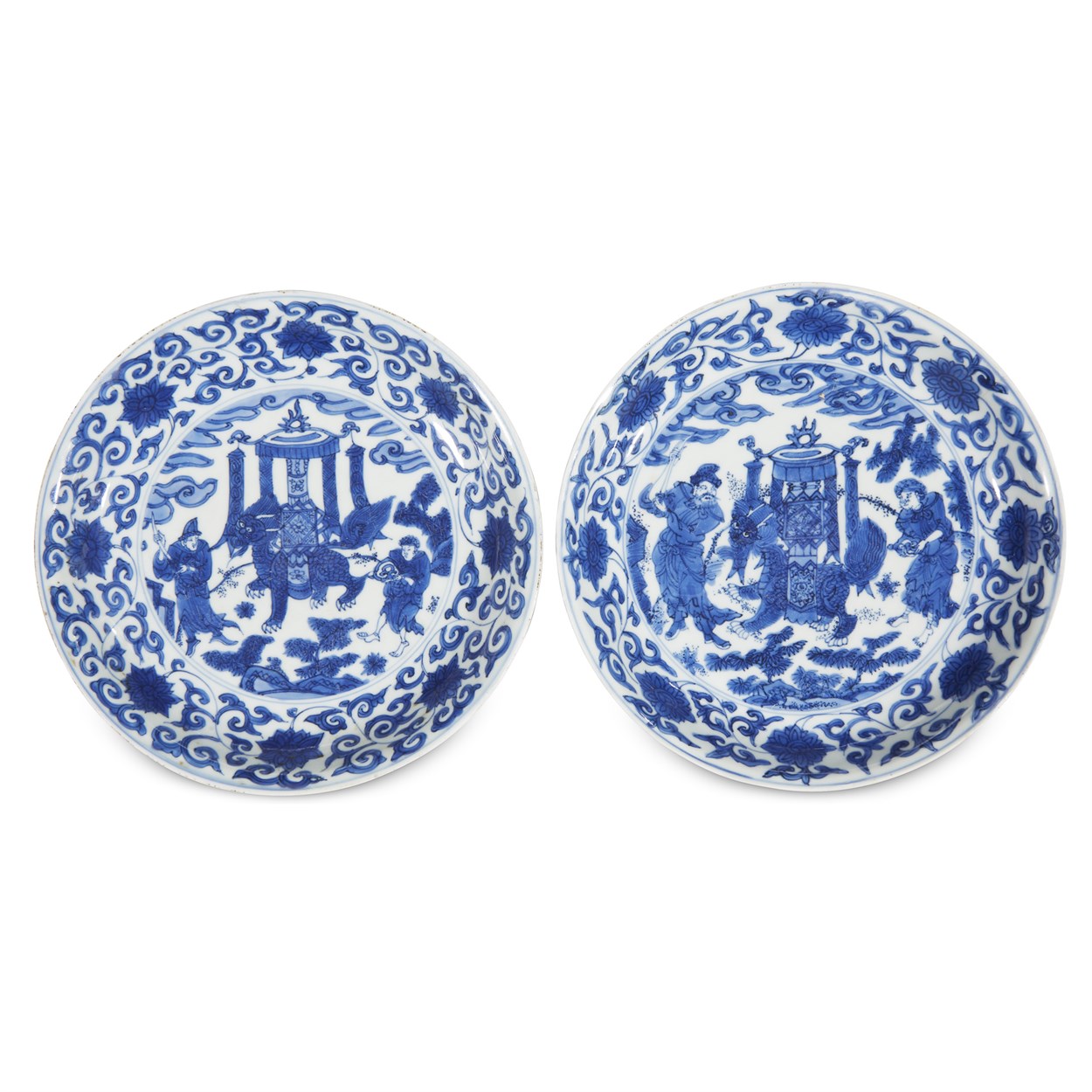 Lot 79 - A matched pair of blue and white porcelain "Qilin and Foreign Attendants" dishes