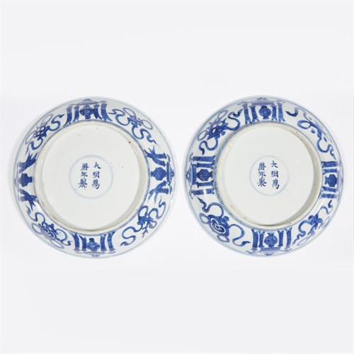 Lot 79 - A matched pair of blue and white porcelain "Qilin and Foreign Attendants" dishes