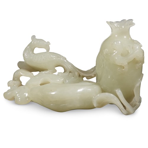 Lot 252 - A Chinese carved pale celadon jade "Phoenix, Qilong and Pomegranate" brush washer