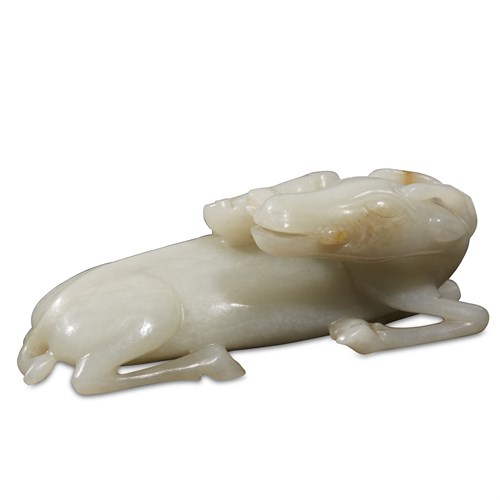 Lot 260 - A Chinese carved greyish-white jade "Deer and Lingzhi" group