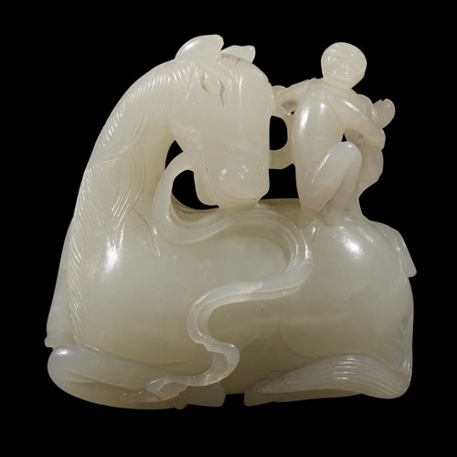 Lot 259 - A Chinese carved white jade "Horse and Monkey" group