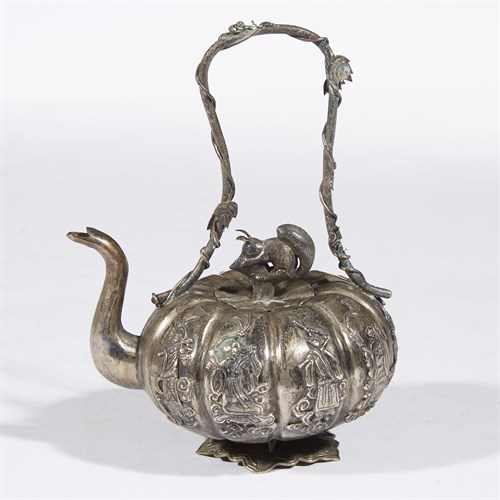 Lot 226 - A small Chinese silver repousse wine pot