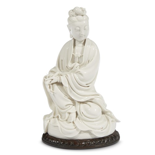 Lot 109 - A Chinese Dehua porcelain figure of Guanyin seated