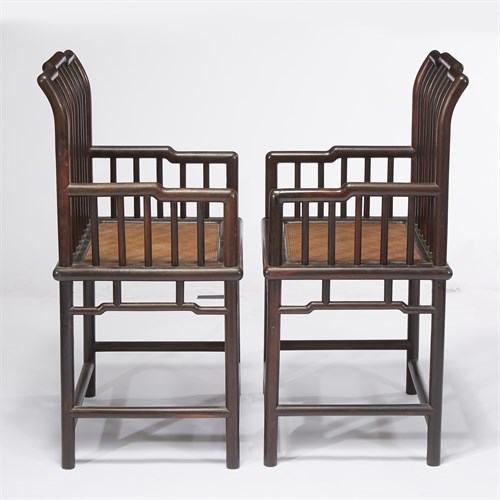 Lot 188 - A pair of Chinese hardwood spindle-back armchairs