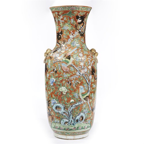 Lot 225 - An unusual Chinese molded porcelain and famille rose-decorated "Black Dragons" vase