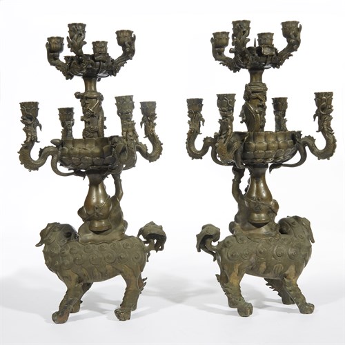 Lot 177 - An unusual pair of bronze "Foreigner, Shishi and Dragons" candelabra