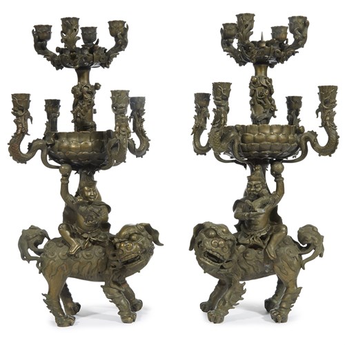 Lot 177 - An unusual pair of bronze "Foreigner, Shishi and Dragons" candelabra