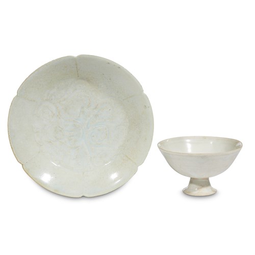 Lot 57 - A Chinese qingbai footed cup and a peony-carved floriform bowl