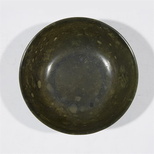 Lot 269 - A Chinese spinach jade bowl