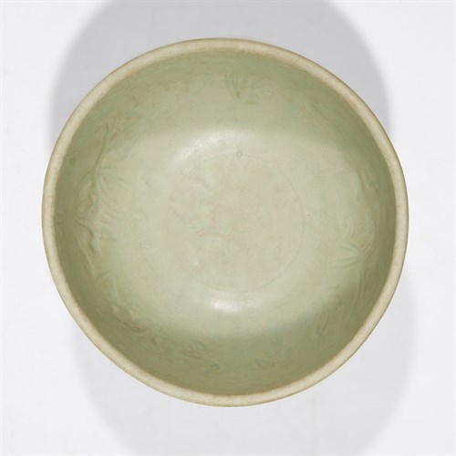 Lot 64 - A Chinese Lonquan celadon molded bowl