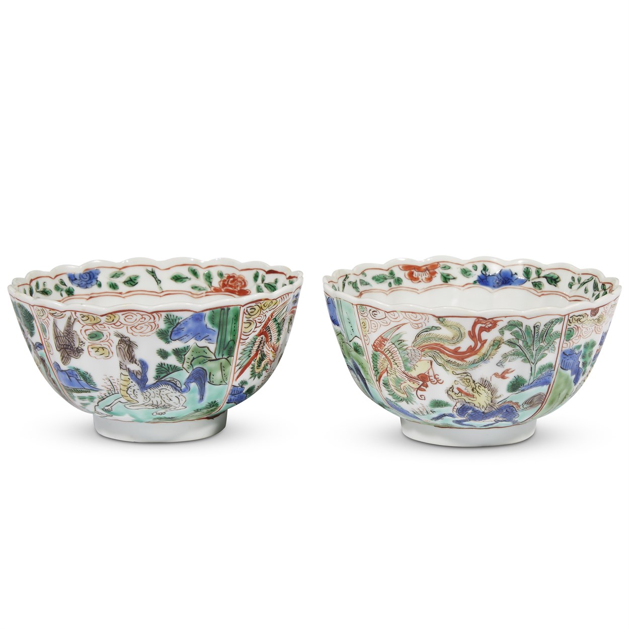 Lot 103 - A pair of Chinese famille verte-decorated "Auspicious Creatures" fluted bowls