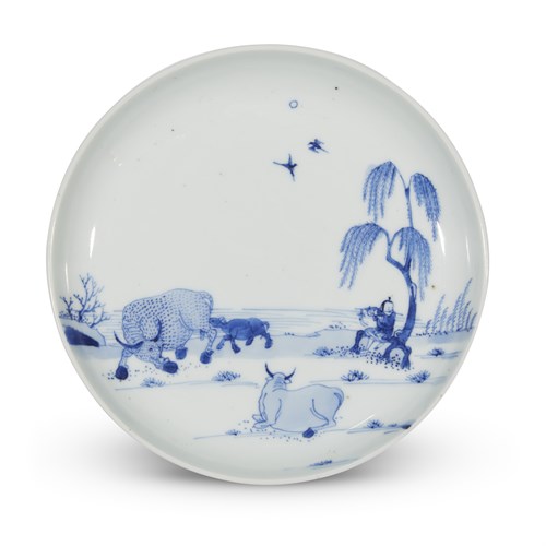Lot 98 - A Chinese blue and white porcelain "Playing Flute to the Water Buffalo" small dish