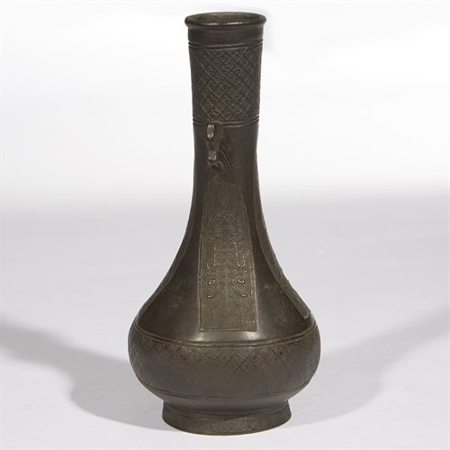 Lot 74 - A Chinese patinated bronze vase with cloud handles