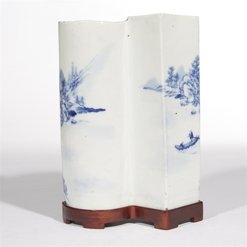 Lot 230 - A Chinese blue and white landscape-decorated "double-fan"-section vase