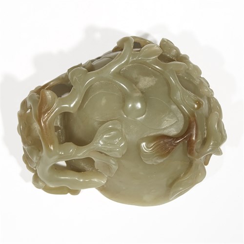 Lot 246 - A Chinese celadon jade carved "Blossom" cup