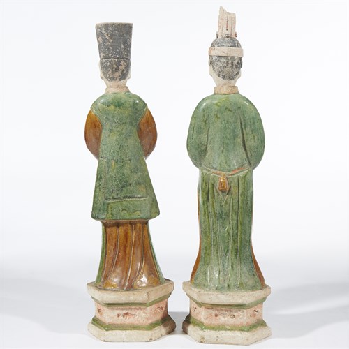 Lot 70 - A pair of Chinese sancai-glazed and painted pottery attendants