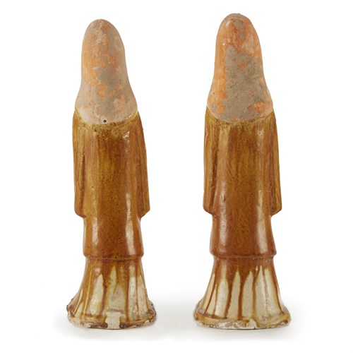 Lot 30 - A pair of Chinese painted and sancai-glazed attendants