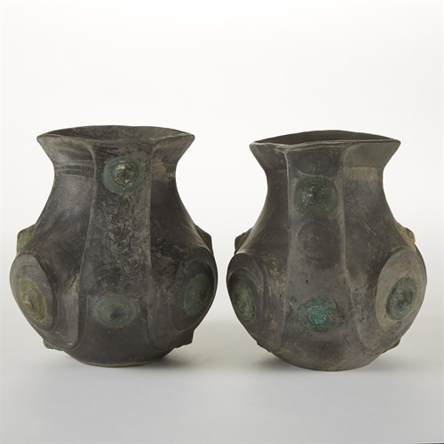 Lot 12 - A pair of Chinese grey pottery amphora with copper appliques