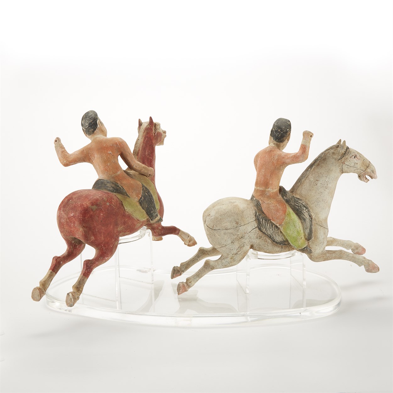 Lot 22 - A pair of painted pottery Polo Players