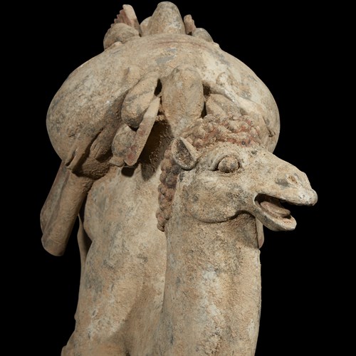 Lot 16 - A Chinese grey pottery model of a kneeling Bactrian camel
