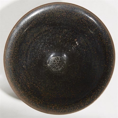 Lot 42 - A Chinese Jian-type black-glazed flared teabowl with russet mottling
