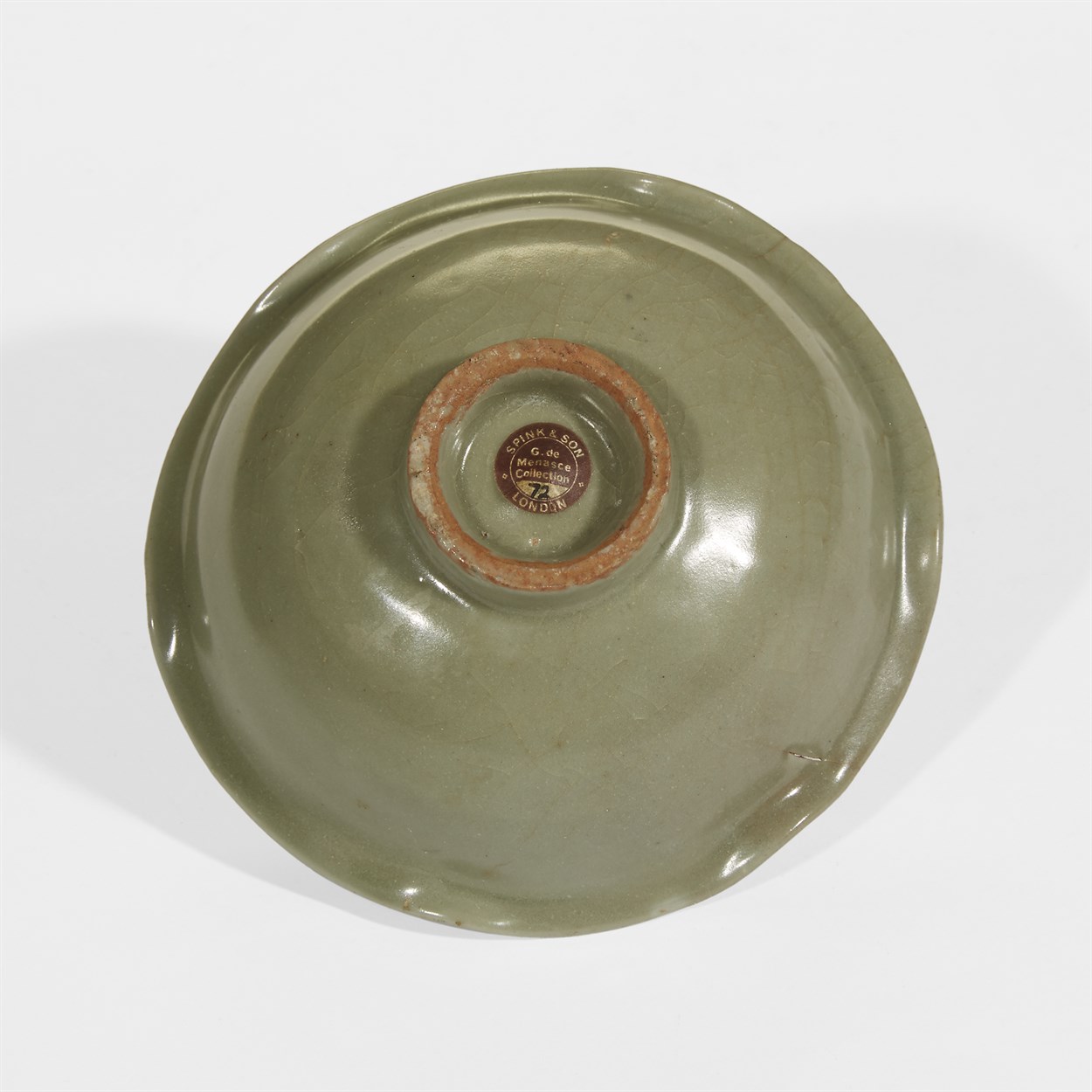 Lot 49 - A Chinese Longquan celadon small "Lotus and Tortoise" bowl