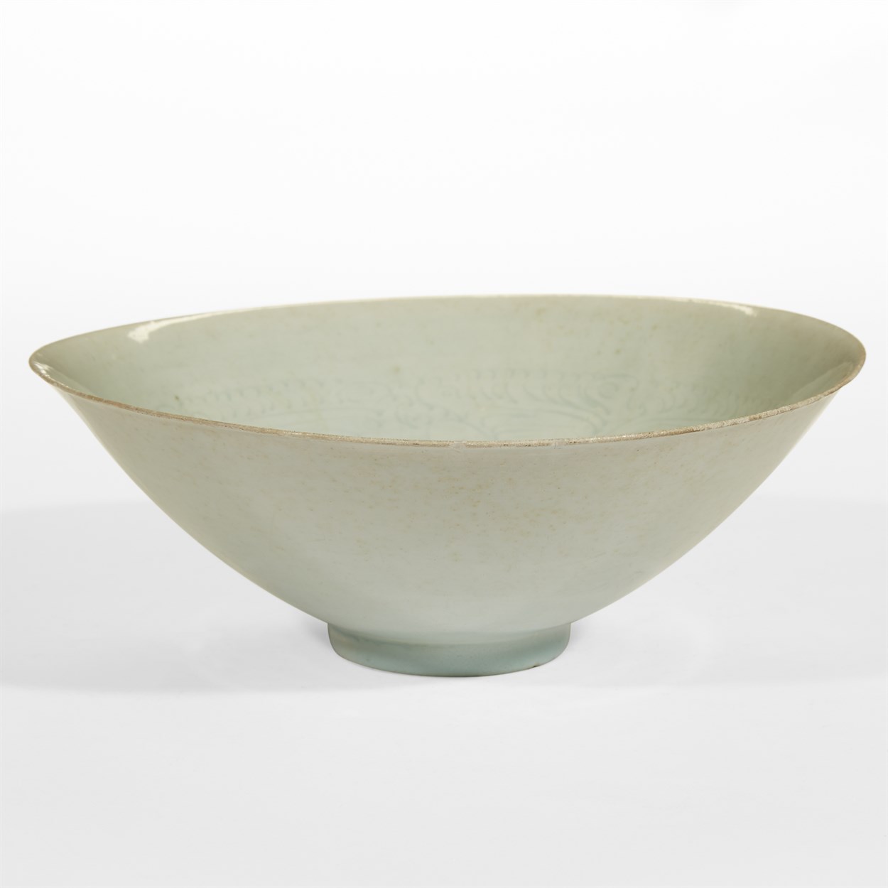 Lot 58 - A Chinese incised qingbai "Boys" bowl