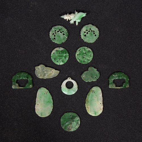 Lot 273 - A group of thirteen small Chinese jadeite charms