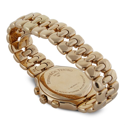 Lot 72 - An eighteen karat gold chronograph bracelet watch with date, Tiffany & Co.