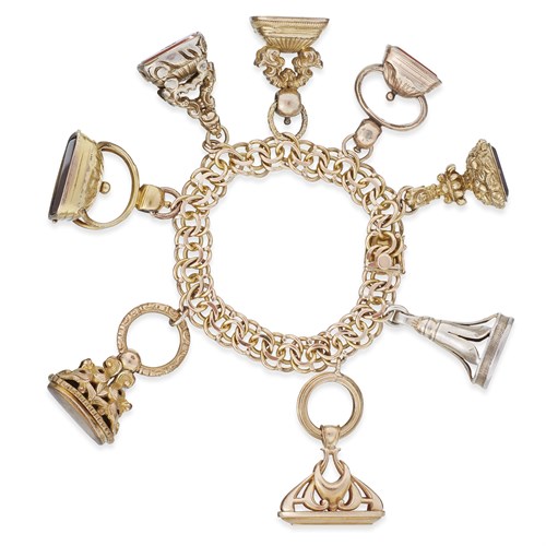 Lot 25 - A fourteen karat gold charm bracelet
