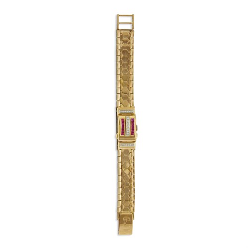 Lot 84 - An eighteen karat gold and diamond covered dial bracelet watch, Bucherer