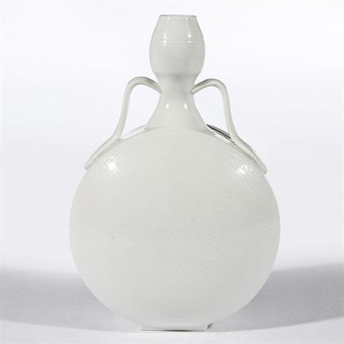 Lot 141 - A Chinese Ming-style incised white-glazed porcelain moonflask